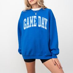 Get game day ready with our brand new crewneck in three fun, sporty colors! whether you're cheering from the stands or watching from home this game day crew is the perfect way to show your support and cheer for your favorite team! Pair it oversized with bike shorts and our mama tote bag for the perfect easy fit! DETAILS Unisex sizing - aka mens sizing. If you want a looser fit, we recommend ordering your normal size or one up for an oversized fit. If you prefer a more fitted style, size down one Casual Fall Activewear For Sports Events, Casual Activewear For Fall Sports Events, Sporty Team-colored Activewear For Game Day, School Spirit Sweatshirt With Team Logo For Game Day, Game Day School Spirit Sweatshirt With Team Logo, Game Day Crew Neck Sweatshirt, Game Day Crew Neck Sweatshirt For Sports Season, School Spirit Sweatshirt For Game Day, Collegiate Crew Neck Sweatshirt For Game Day