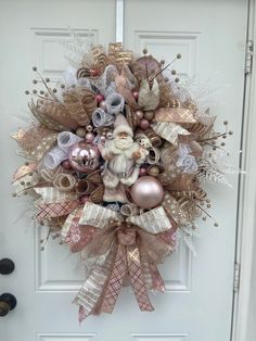 a christmas wreath hanging on the front door