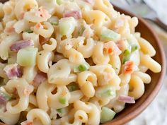 a bowl filled with macaroni salad on top of a table