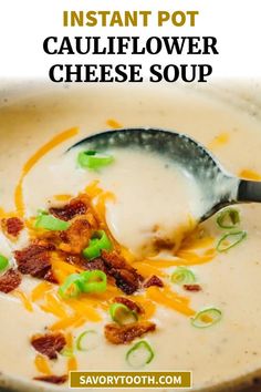 a spoonful of cauliflower cheese soup in a bowl with bacon and green onions