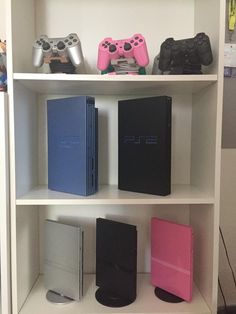 a book shelf filled with different types of video game controllers