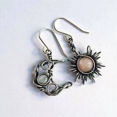 Mismatched Sun and Moon Earrings Made from Tibetan Silver, and Acrylic Accent Stones In traditional Wicca, The Moon represents the Goddess, and the Sun represents the God You will receive one of each - one Moon and One Sun Earring to make up the set.  Ships from Ontario Canada Sun And Moon Earrings, Korean Jewelry, Boho Style Jewelry, Moonstone Earrings, Earring Type, Crystal Drop Earrings, Moon Earrings, Sun And Moon, Moon Pendant