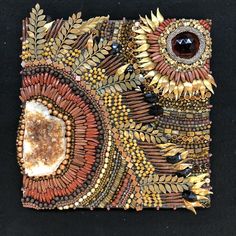 a piece of art made out of beads and stones