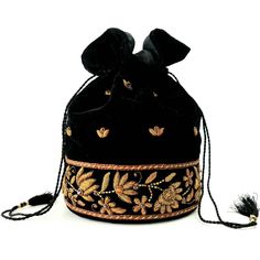 "Look your best wearing this luxurious black velvet pouch bag, exquisitely embroidered with glittery antiqued silver metallic threads and genuine semi precious stones. It is certain to bring you compliments. Perfect for an Indian wedding or for having fun around town! Expertly hand embroidered by third generation master zardozi artisans. Of heirloom quality. - 9\" x 6\" with useable interior space 6\" x 6 \". - Rigid bottom and 2\" base, so bag sits nicely. - Wrist cord with tassel, 6 in. drop p Luxury Gift Bucket Bag Shaped As A Pouch, Festival Evening Potli Bag With Handwork, Evening Handwork Potli Bag For Festivals, Bollywood Style Embroidered Evening Potli Bag, Evening Zari Work Potli Pouch Bag, Evening Zari Work Potli Pouch, Traditional Black Evening Bag, Evening Potli Bag With Gold Embroidery For Festivals, Festive Evening Potli Bag With Zari Work