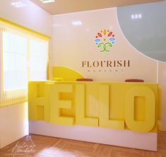 the logo for florisish nursery is displayed in an empty room