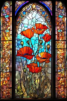 a stained glass window with red flowers in it