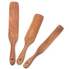 three wooden utensils on a white background