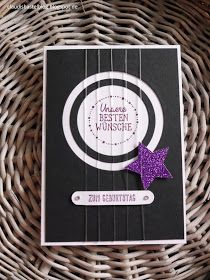 a close up of a card on a wicker basket with a purple star brooch