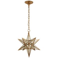 a star hanging from a chain on a white wall