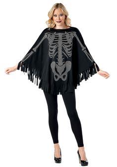 a woman wearing a skeleton cape and black leggings is posing for the camera