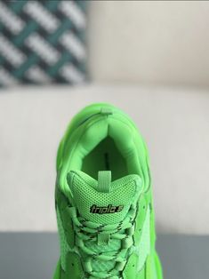 Turn heads and break boundaries with these neon green Balenciaga Triple S-inspired sneakers. The electrifying colorway and signature chunky sole make a bold statement, while the premium materials ensure lasting comfort. Embrace the avant-garde and step into the future of footwear. Functional Green Sneakers With Abzorb Midsole, Green Sporty Platform Sneakers With Round Toe, Green Lace-up Chunky Sneakers For Streetwear, Modern Green Running Shoes With Rubber Sole, Trendy Green Chunky Sneakers With Round Toe, Green Platform Sneakers With Branded Insole, Green High-top Chunky Sneakers In Sporty Style, Trendy Green Sneakers With Rubber Sole, Green High-top Chunky Sneakers