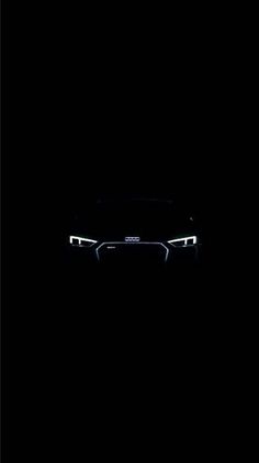 the front end of a car in the dark