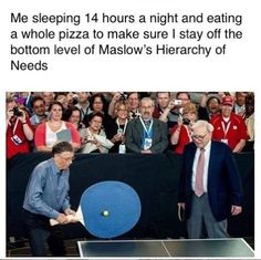 a man is playing ping pong in front of a crowd with his racket