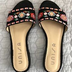 Add A Touch Of Elegance To Your Summer Wardrobe With These Beautiful Unisa Embroidered Sandals In Black. These Sandals Are Perfect For Any Occasion, Whether You're Running Errands Or Enjoying A Day Out With Friends. Featuring A Unique Embroidered Design, These Sandals Are A Must-Have For Any Fashion-Forward Woman. The Black Color And Elegant Accents Make Them A Perfect Match For Any Outfit. These Sandals Are Available In Us Shoe Size 7.5 And Are Ideal For Women Who Want To Add A Touch Of Sophist Black Embroidered Round Toe Sandals, Black Embroidered Closed Toe Sandals, Black Embroidered Open Toe Sandals, Embroidered Sandals, Red Block Heels, Bright Heels, Black Sandals Flat, Ankle Strap Block Heel, Black Block Heels