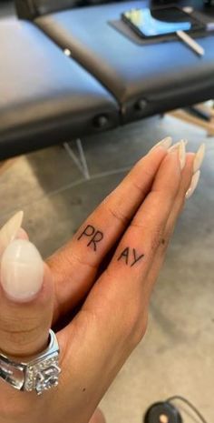 Finger Tattoos | Check Out These Finger Tattoo Designs & Ideas... Tatoos On Finger Woman, Pray Tattoo On Fingers, Tattoo Finger Woman, Pray Finger Tattoo, Writing On Finger Tattoo, Finger Tattoos With Friends, Small Tattoo Women Ideas, 444 Tattoo On Finger, Small Side Finger Tattoos For Women