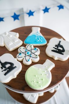 decorated cookies sitting on top of a wooden table