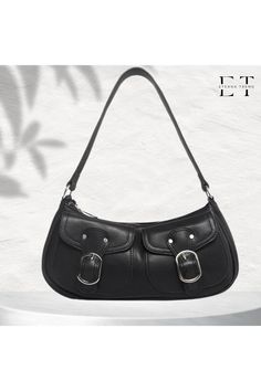 Product Features: Dimensions: Width 29 cm (11.4 inches), Height 13 cm (5.1 inches), Depth 8 cm (3.1 inches) Strap Length: 48 cm (18.9 inches), fixed strap. Usage: Can be used as a handbag or a shoulder bag. Interior Structure: Single compartment with one small pocket inside. Front Design: Two separate belt-like magnetic closure pockets. Material: High-quality, handcrafted shiny synthetic leather. Closure: Zippered. Accessory Colors: Silver. Other Features: Soft leather, easy to clean. Front Design, Synthetic Leather, Inside Pocket, Purses And Handbags, Soft Leather, Halloween Shopping, Shoulder Bags, Accessory Gift, Buckle