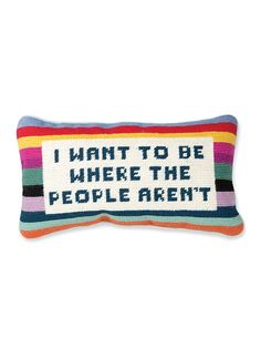 a colorful pillow with the words i want to be where the people aren on it