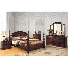 a bedroom scene with focus on the bed, dresser and two nightstands that have mirrors on them