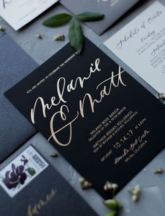 black and gold wedding stationery with calligraphy