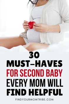 a pregnant woman holding a red heart in her hands and text overlay reads 30 must - haves for second baby every mom will find helpful