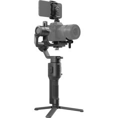 the camera is mounted on top of a tripod with its arm extended to it