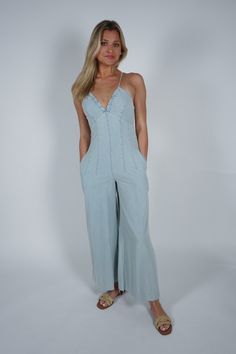 Say hello to the Amy Jumpsuit, your new go-to for casual cool. This sleeveless jumpsuit features a light blue wash denim, perfect for those warm days. Slip into style and comfort with this versatile piece. Size + Fit Ginny is 5’8” and wearing a size Small Content + Care 80% Cotton 15% Polyester 5% Viscose Hand Wash Cold Outerwear Vest, Icy Blue, Crop Top Sweater, Vacation Dresses, Little White Dresses, Active Wear Outfits, Sleeveless Jumpsuits, Country Chic, Matching Dresses