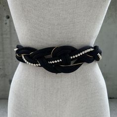 Vintage Milor sailor black belt, unique black and gold tone braided waistband, nylon rope belt, knotted rope belt, elegant accessory women Embark on a journey of refined maritime elegance with our Vintage Milor Sailor Black Belt, an exquisite fusion of sophistication and nautical charm. The black and gold tone braided waistband, meticulously crafted from resilient nylon ropes, presents a unique knotted rope design, evoking the spirit of high-seas adventure. Adorned with delicate gold tone beads, this belt strikes a perfect balance between opulence and maritime allure. This belt is not merely an accessory; it's a statement piece designed for the woman who appreciates timeless elegance. Whether cinched around a flowing dress or paired with tailored trousers, it adds a touch of distinction to Luxury Rope Belt For Formal Occasions, Chic Black Adjustable Chain Belt, Adjustable Black Embroidered Belt, Black Embroidered Adjustable Belt, Adjustable Black Evening Belt, Black Embroidered Belt For Party, Party Black Embroidered Belt, Adjustable Gold Rope Belt, Knotted Rope