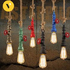 an assortment of light bulbs hanging from ropes