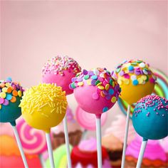 colorful cake pops with sprinkles on them