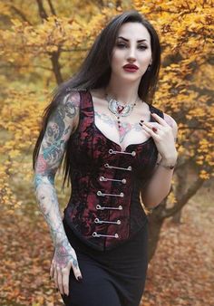 "A Shrine classic!! A heavily constructed corset top in rich red and black tapestry fabric with a great form fit. Heavy metal boning at sides and lycra stretch panel at back adds extra strong support. Fastens in front with seven large kilt pins but also zips in back for easy access. Rich black satin piping around armholes and neckline and black satin lining inside. Trimmed at the bottom with black braid. This is one of our favorites... A very flattering fit for all body types! Comes in sizes sma Red Gothic Sleeveless Top, Red Sleeveless Gothic Top, Black Tapestry, Gothic Costume, Kilt Pins, Kilt Skirt, Goth Women, Tapestry Fabric, Gothic Beauty