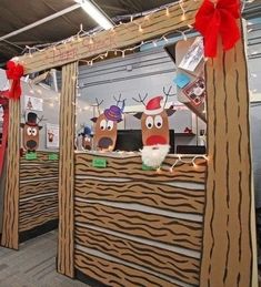 an office cubicle decorated for christmas with reindeer decorations