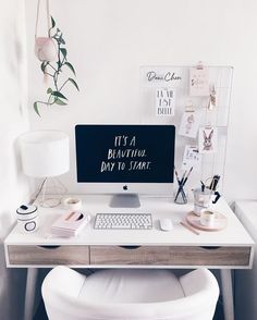 a white desk with a computer on it