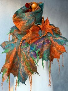 "Beautiful felted Scarf in green and orange shades «Maple Leaves» Beautiful brooch in set with scarf.  100% Handmade.  I used softest superfine merino wool, silk, viscose and bamboo  fibers to make it.  Merino is very soft, it doesn't irritate your skin.   Size: 67\"x 10-16\" (170 cm x 25-41 cm) I make all of my wool scarves using a technique called felting, which is a type of wet felting.  Soap, hot water, and agitation bind the fibers together. Great for wearing both inside and out.  Care: Handwash in cool water and gentle soap. Iron with steam. Please do not place to washing machine. Please check out  http://ShellenD.etsy.com  for more information and to see my works." Art Fil, Nuno Felt Scarf, Scarf Wool, Felted Scarf, Art Scarves, Wet Felt, Wool Art, Textile Fiber Art, Felting Tutorials