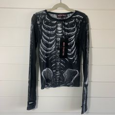 Dolls Kill Skeleton See Through Shirt Trickz N' Treatz Boneyard Mesh Tee. Xs. New With Tags. Please Reach Out For Any Questions. Offers Are Always Welcome. Bundle With Other Items From My Closet For The Best Deal! Super Fast Shipping: We Ship Out The Next Business Day! (B2) Long Sleeve Skeleton Shirt, Edgy Long Sleeve Halloween Tops, Trendy Skull Shaped Tops For Fall, Halloween Punk Stretch Tops, Fitted Punk Distressed Top, Emo Graphic Print Tops For Fall, Punk Distressed Fitted Tops, Gothic Long Sleeve Tops For Festivals, Punk Style Distressed Fitted Tops