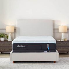 the tempur - pedic mattress is on display in front of two nightstands