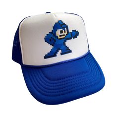 Mega Man Hat Snapback Cap | Vintage Style Video Game Megaman Trucker Hat | A Vintage Style Trucker Hat Cap Color - Blue Size - One Size Hits Most Adult Unisex Adjustable Snapback / Adjustable Bill Pure White Foam Front / High Quality Polyester Soft Mesh Back / Button on Top Most Orders Ship within 24 Hours! Retro Video, Funny Hats, Retro Videos, Retro Video Games, Man Hat, Hats Snapback, Mega Man, Cute Hats, Snapback Cap