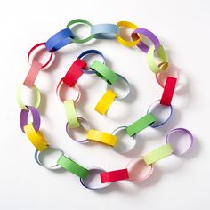 several colored paper chains are arranged in a circle