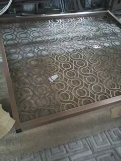 a metal frame with circles on it in the middle of an area that has been cleaned