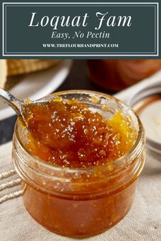 a jar filled with jam sitting on top of a table