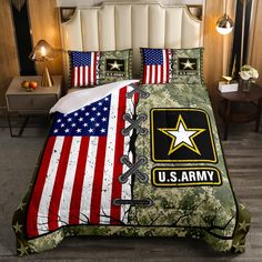 a bed with an army themed comforter and matching pillow cases on top of it