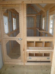 the inside of a wooden house with metal mesh doors