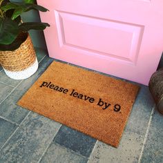 a door mat that says please leave by 9 on it next to a potted plant