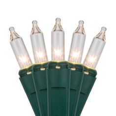 green christmas lights with clear bulbs on white background