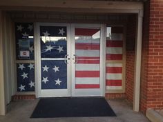 an american flag painted on the front door of a building