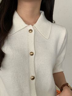 Half sleeve wool cashmere blend with collar and gold button through front. Model is in MINUSEY ONE SIZE. ✔️ Free worldwide express shipping over $100✔️ Loved by 6,500+ customers✔️ Limited edition collections, maximum style⠀⠀⠀⠀⠀⠀⠀⠀⠀Stay ahead of the trend with can’t-find-anywhere-else staples. Your closet will thank you 💕* MINUSEY ONE SIZE = EU 34-38, US 2-6* 75% Merino Wool / 10% Cashmere / 15% Nylon* Dry clean* Made in Korea - Model Height: 172cm/5'7" (US2, EU34) White Collared Sweater With Buttons, Chic Collared Sweater With Buttons, Knit Workwear Polo Sweater With Buttons, Knit Polo Sweater With Buttons For Workwear, Elegant Collared Sweater With Button Closure, Collared Polo Sweater With Buttons For Winter, Elegant Button-up Polo Sweater For Work, Winter Tops With Button Closure And Collared Neckline, Elegant Collared Sweater With Button Cuffs