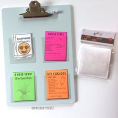 a clipboard with sticky notes attached to it and some magnets on the side