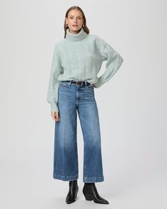 This high rise, extra wide leg has a cropped, ankle length silhouette. This pair is crafted in PAIGE VINTAGE denim with a portion of organic cotton and comes in a light/medium wash with lived-in details. PAIGE VINTAGE takes all the work out of breaking in your favorite pair of vintage jeans. We've combined the comfort of stretch with everything you love about authentic vintage denim to create super soft jeans that feel perfectly lived-in from the very first wear. Eco-positive methods and modern Winter Wide Leg Flare Jeans, Winter Wide-leg Flare Jeans, Fall Cropped Flare Jeans With Relaxed Fit, Fall Light Wash Cropped Jeans, Light Wash Wide Leg Cropped Jeans For Fall, Fall Light Wash Wide Leg Cropped Jeans, Fall Relaxed Fit Wide-leg Cropped Jeans, Fall Wide Leg Cropped Jeans In Denim Blue, Fall Wide-leg Cropped Denim Jeans