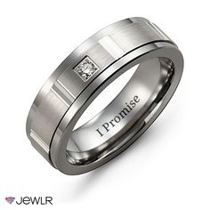 a men's ring with a princess cut diamond in the center and an inscription on it