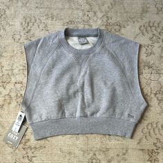 Aritzia Tna Cozy Perfect Crop Sweatshirt. New With Tags, Never Worn! The Color Is Heather Chrome. Would Be So Cute With Sweat Shorts. Sweatshirt Material With Cutoff Sleeves Like A Muscle Tee Kind Of. Cozy Fit Basic Top For Loungewear, Comfortable Cotton Tops With Cozy Fit, Comfortable Cozy Fit Cotton Top, Cozy Fit Comfortable Cotton Tops, Comfy Cotton Everyday Tops, Comfy Cotton Tops For Everyday, Comfy Everyday Cotton Tops, Cozy Crew Neck Top For Loungewear, Comfy Cotton Tops With Cozy Fit